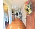 Inviting entryway with hardwood floors, coat rack, and view into the open concept kitchen and living areas at 2077 Appaloosa Way Way, Conyers, GA 30012