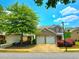 Charming two-story home with a two-car garage, colorful landscaping and a sidewalk at 2077 Appaloosa Way Way, Conyers, GA 30012