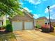 Charming two-car garage in a well-maintained neighborhood with landscaped front yard and sidewalk at 2077 Appaloosa Way Way, Conyers, GA 30012