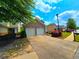 Charming two-car garage in a well-maintained neighborhood with landscaped front yard and sidewalk at 2077 Appaloosa Way Way, Conyers, GA 30012