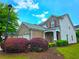 Attractive two-story home with brick and siding, complemented by lush landscaping and a neatly kept lawn at 2077 Appaloosa Way Way, Conyers, GA 30012