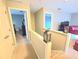 A view of the upstairs hallway near the living room offers an airy and bright feel at 2077 Appaloosa Way Way, Conyers, GA 30012