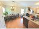 Eat-in kitchen features hardwood floors, modern lighting, and stainless steel dishwasher at 2077 Appaloosa Way Way, Conyers, GA 30012