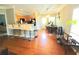 Well-lit kitchen and dining area featuring hardwood floors, modern appliances, and a breakfast bar at 2077 Appaloosa Way Way, Conyers, GA 30012
