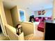 Upstairs landing offers a view of a relaxing living area with red sofa and TV at 2077 Appaloosa Way Way, Conyers, GA 30012