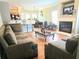 Comfortable living room with a fireplace, hardwood floors, and stylish furniture creating a cozy atmosphere at 2077 Appaloosa Way Way, Conyers, GA 30012