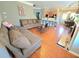 Comfortable living room with hardwood floors, brown sofas, and open to the kitchen at 2077 Appaloosa Way Way, Conyers, GA 30012