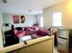 Comfortable living room features a large television and stylish, eye-catching decor at 2077 Appaloosa Way Way, Conyers, GA 30012