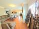 Open-concept living room with hardwood floors, neutral tones, and seamless flow to kitchen and dining areas at 2077 Appaloosa Way Way, Conyers, GA 30012