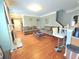 Bright living room featuring hardwood floors, a cozy fireplace, and seamless flow to the kitchen at 2077 Appaloosa Way Way, Conyers, GA 30012