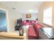 Cozy loft-style living room with plush leather seating and a wall-mounted television at 2077 Appaloosa Way Way, Conyers, GA 30012