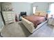 Comfortable main bedroom boasts neutral tones and a plush bed at 2077 Appaloosa Way Way, Conyers, GA 30012