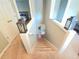 Staircase leading down with carpeted steps and decorative lanterns on the railing at 2077 Appaloosa Way Way, Conyers, GA 30012