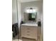 Updated bathroom with marble countertop, vanity, mirror, and modern lighting at 2170 Beecher Sw Cir, Atlanta, GA 30311