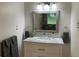 Stylish bathroom features a marble vanity and modern fixtures at 2170 Beecher Sw Cir, Atlanta, GA 30311