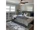 Bedroom with hardwood floors, ceiling fan, and bookshelves at 2170 Beecher Sw Cir, Atlanta, GA 30311