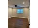 Spacious bedroom features hardwood floors, modern ceiling fan, and window with natural light at 2170 Beecher Sw Cir, Atlanta, GA 30311