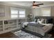 Comfortable bedroom with built-in bookshelves and hardwood floors at 2170 Beecher Sw Cir, Atlanta, GA 30311