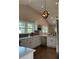 Bright kitchen featuring white cabinets, stainless steel appliances, and stylish pendant lighting at 2170 Beecher Sw Cir, Atlanta, GA 30311