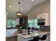 Bright kitchen with stainless steel appliances and pendant lighting over island at 2170 Beecher Sw Cir, Atlanta, GA 30311