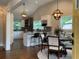 Open kitchen and dining area featuring stainless appliances, quartz countertops, and modern lighting at 2170 Beecher Sw Cir, Atlanta, GA 30311