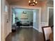 Open-concept living room with hardwood floors, stylish decor, and an abundance of natural light at 2170 Beecher Sw Cir, Atlanta, GA 30311