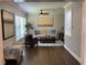 Bright living room boasts hardwood floors, ample seating, and a sun-drenched window at 2170 Beecher Sw Cir, Atlanta, GA 30311