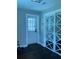 Room features a door with glass panels and a sliding closet door with a decorative geometric pattern at 2170 Beecher Sw Cir, Atlanta, GA 30311