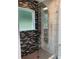 Modern shower with rainfall shower head, sleek glass enclosure, and neutral tile at 2170 Beecher Sw Cir, Atlanta, GA 30311