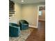 Sitting area with hardwood floor, patterned area rug, and chairs at 2170 Beecher Sw Cir, Atlanta, GA 30311
