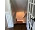 Stairwell with natural wood steps and decorative glass French door at 2170 Beecher Sw Cir, Atlanta, GA 30311