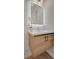 Modern bathroom vanity with illuminated mirror and stylish hexagon tile accent wall at 458 Connally Se St, Atlanta, GA 30312