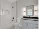 Bathroom with white subway tile, black finishes, and vanity at 458 Connally Se St, Atlanta, GA 30312