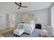 Bright bedroom featuring a ceiling fan, neutral decor, wood floors, and a large window for natural light at 458 Connally Se St, Atlanta, GA 30312