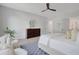 Bright, spacious bedroom featuring a ceiling fan, neutral decor, and light hardwood flooring at 458 Connally Se St, Atlanta, GA 30312