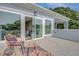 Deck showcasing a peak into interior through large glass doors and an outdoor seating area at 458 Connally Se St, Atlanta, GA 30312