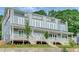 Modern townhome featuring a gray exterior, multiple decks, and manicured landscaping at 458 Connally Se St, Atlanta, GA 30312