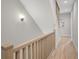Light-filled hallway featuring wood floors and a staircase at 458 Connally Se St, Atlanta, GA 30312