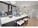 Modern kitchen with stainless steel appliances, gray cabinets, and a large island with seating at 458 Connally Se St, Atlanta, GA 30312