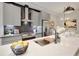 Modern kitchen with stainless steel appliances, gray cabinets, and a large island at 458 Connally Se St, Atlanta, GA 30312