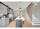 Modern kitchen boasts stainless steel appliances, gray cabinets, and a large island at 458 Connally Se St, Atlanta, GA 30312