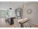Open-concept kitchen and dining area with a large island and modern light fixtures at 458 Connally Se St, Atlanta, GA 30312