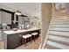 Modern kitchen with stainless steel appliances, gray cabinets, and a large island with seating at 458 Connally Se St, Atlanta, GA 30312