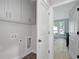 Convenient laundry room with cabinetry and space for laundry appliances at 458 Connally Se St, Atlanta, GA 30312