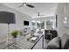 Open concept living room with multiple ceiling fans and windows at 458 Connally Se St, Atlanta, GA 30312