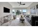 Inviting living room with ceiling fan and access to a patio at 458 Connally Se St, Atlanta, GA 30312
