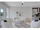 Bright living room open to the kitchen features contemporary decor and hardwood floors at 458 Connally Se St, Atlanta, GA 30312