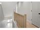 Bright staircase with natural wood railing and hardwood floors at 458 Connally Se St, Atlanta, GA 30312