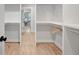 Spacious walk-in closet with custom shelving and ample storage space at 458 Connally Se St, Atlanta, GA 30312