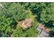 Aerial view of the home surrounded by lush greenery and mature trees in a peaceful, wooded setting at 481 Meadowbrook Se Dr, Marietta, GA 30067